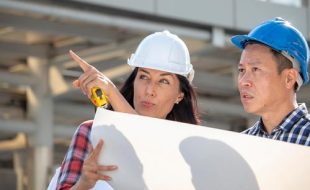 engineer-woman-is-pointing-for-project-manager-to-see-building_t20_axQ2rp